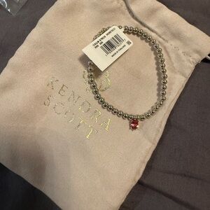 Kendra Scott Silver Bracelet with Red Charm